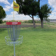 A basket in the Caddoa Disc Golf course.